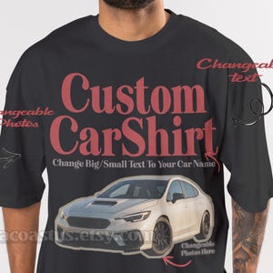 May include: Black t-shirt with the text "Custom CarShirt" in red, featuring a white car graphic. The shirt includes prompts for customizable text and photos, with a website address at the bottom.