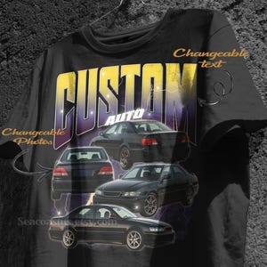 May include: Black t-shirt featuring a graphic design with the text "CUSTOM AUTO" in yellow and purple. The design includes illustrations of black cars. The words "Changeable text" and "Changeable Photos" are also visible.