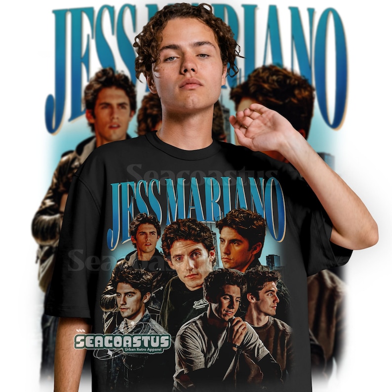 May include: Black t-shirt with a vintage-style graphic of Jess Mariano from the TV show Gilmore Girls. The graphic features multiple images of Jess Mariano in a collage style with the text "Jess Mariano" in a blue and white font.