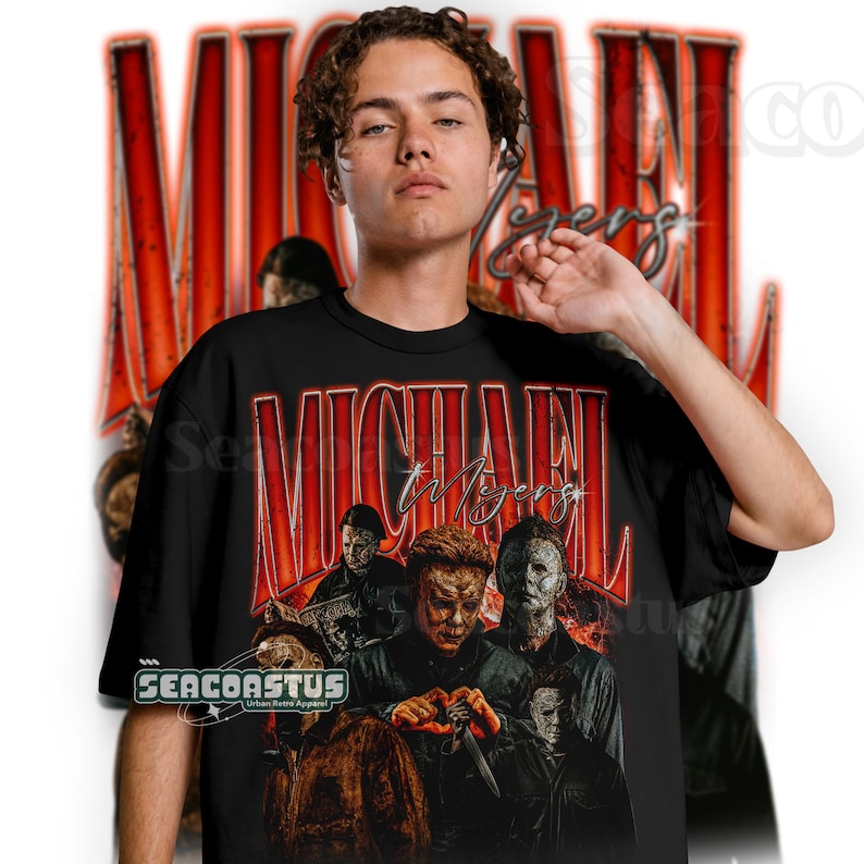 May include: Black t-shirt with a graphic print of Michael Myers from the Halloween franchise. The graphic features multiple images of Michael Myers in different poses, with the text "MICHAEL MYERS" in red letters above the images.
