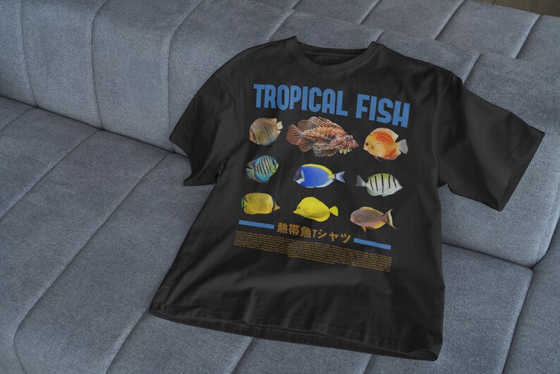 May include: Black t-shirt with a graphic of colorful tropical fish and the text "TROPICAL FISH" in blue letters. The text "熱帯魚デザイン" is also printed on the shirt.