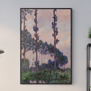 May include: A framed landscape painting featuring tall trees with blue-green foliage against a soft pink and purple sky. The artwork depicts a tranquil scene with a body of water and lush greenery at the base of the trees.