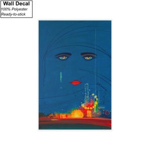 May include: A blue and red wall decal featuring a stylised illustration of a woman's face with a cityscape in the background. The woman's eyes are large and blue, and her lips are red. The cityscape is made up of tall buildings with lights.