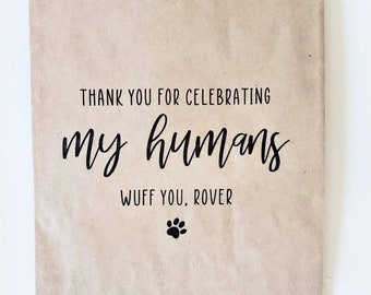 May include: A brown paper bag with the text "Thank you for celebrating my humans. Wuff you, Rover" and a paw print.