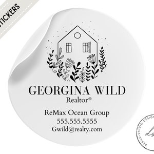 May include: Black and white sticker with a house illustration, floral accents, and the text "GEORGINA WILD Realtor® ReMax Ocean Group 555.555.5555 Gwild@realty.com".