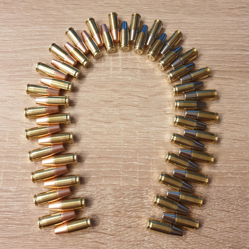 Patronen Magnete 9mm Luger 5 Stück mit starker magnetischer Flachkopf Geschossattrappe und Zündhütchenattrappe als Neodym Magnet zdjęcie 9