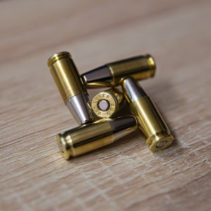 Patronen Magnete 9mm Luger 5 Stück mit starker magnetischer Flachkopf Geschossattrappe und Zündhütchenattrappe als Neodym Magnet zdjęcie 1
