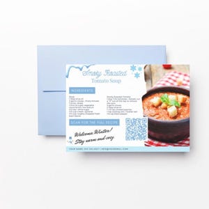 Pode incluir: Um cart&atilde;o de receita para Sopa de Tomate Assada Defumada com um c&oacute;digo QR para escanear para obter a receita completa. O cart&atilde;o tem um design azul e branco com flocos de neve e uma tigela de sopa de tomate com torradas e manjeric&atilde;o por cima.