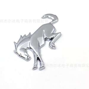 May include: A set of three ceramic mugs with a speckled, matte finish. The mugs are in shades of cream, light gray, and dark gray. Each mug has a simple, minimalist design and a rounded handle. The mugs are suitable for coffee, tea, or other beverages.