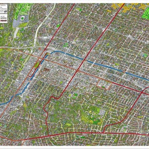 May include: A detailed map of Downtown Pasadena, California, featuring a network of streets, buildings, and green spaces. Red lines indicate the Metro Rail lines, and blue lines represent the light rail. The map includes text and a legend.