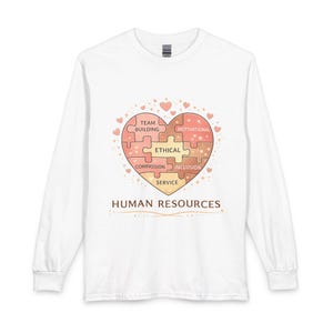 May include: White long-sleeve shirt featuring a heart-shaped puzzle design with the words "Team Building," "Ethical," "Compassion," "Service," "Motivational," and "Inclusion." The words "Human Resources" are printed below the heart.