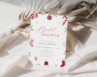 May include: A white bridal shower invitation with red and green Christmas-themed illustrations. The text reads "Bridal Shower", "Olivia Brooks", "Saturday, December 1", and "1 - 4 PM".