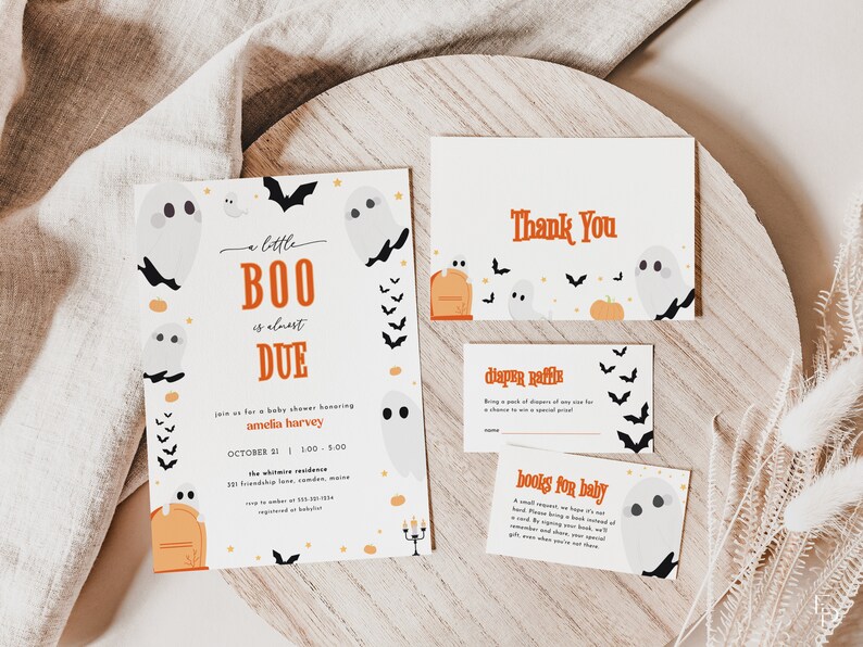 May include: A set of three white cards with orange and black accents. The main card features a ghost and bat illustration with the text "a little BOO is almost DUE" and "Join us for a baby shower honouring Amelia Harvey". The second card says "Thank You" and the third card says "Diaper Raffle".