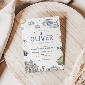 May include: A police-themed birthday invitation featuring a helicopter, police car, and a police station illustration. The invitation reads "Calling All Units" and announces Oliver's 3rd birthday on March 8th.