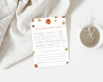 May include: A printable baby shower game card with a fall theme. The card has a pumpkin, leaves, and a clock graphic. It includes sections for guests to predict the baby's name, gender, birth month, day, time, weight, and length. There is also a space for guests to write advice for the parents-to-be.
