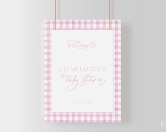 May include: Pink and white gingham welcome sign with the text "Welcome to Charlotte's Baby Shower, April 28, 20XX".