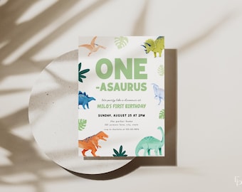 May include: A green and white dinosaur-themed first birthday party invitation with the text "ONE -ASAURUS let's party like a dinosaur at MILO'S FIRST BIRTHDAY SUNDAY, AUGUST 25 AT 2PM the parker home"
