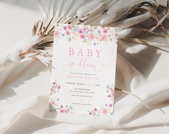 May include: A baby shower invitation featuring a floral design. The invitation reads "Baby in Bloom" and includes the name "Harper Miller". The date and time of the shower are listed as "Sunday, June 23, 1 - 4 PM".