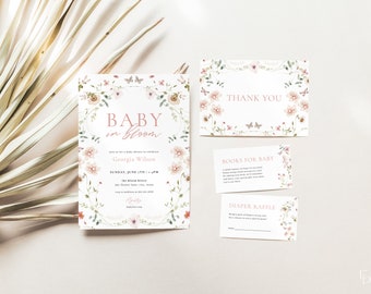 May include: A floral baby shower invitation with the text "Baby in Bloom" and the name "Georgia Wilson". The invitation includes the date and time of the shower, the location, and the registry information. There are also cards for "Books for Baby" and "Diaper Raffle".
