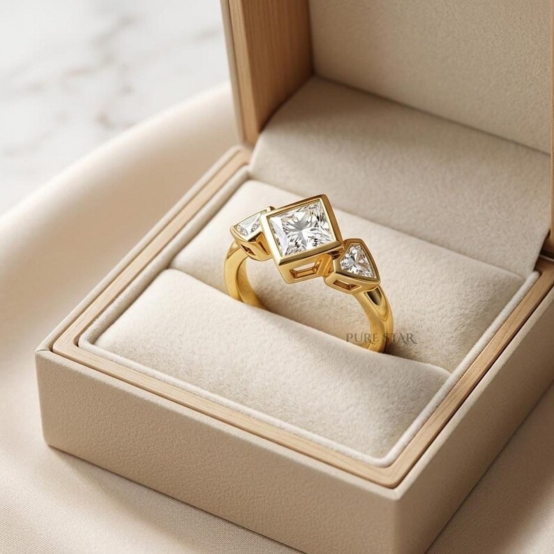 Luxury anniversary ring with princess cut lab grown diamond and geometric shield side stones.