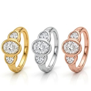 IGI certified oval lab grown diamond ring with three stone bridal design.