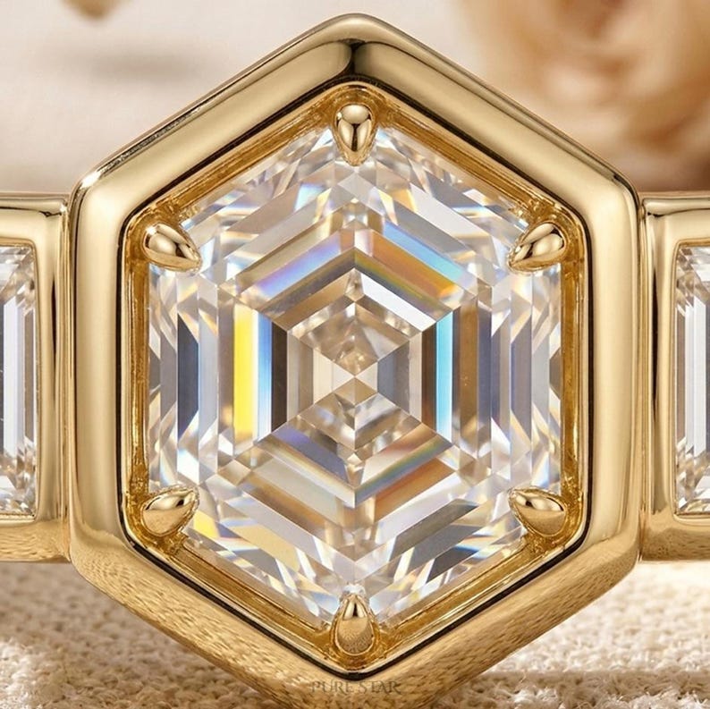 Luxury bezel engagement ring showcasing hexagon center diamond and side baguette stones.