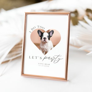 May include: A white card with a rose gold frame, featuring a photo of a French bulldog puppy inside a heart shape. The text on the card reads "I do too, let's party, Love Bear 11.19.20XX".