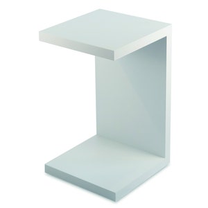 May include: White C-shaped shelf unit with a flat top and bottom shelf. The shelf is made of a smooth, white material.