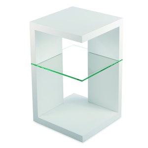 May include: White end table with a glass shelf. The table has a modern design with a square base and open sides.