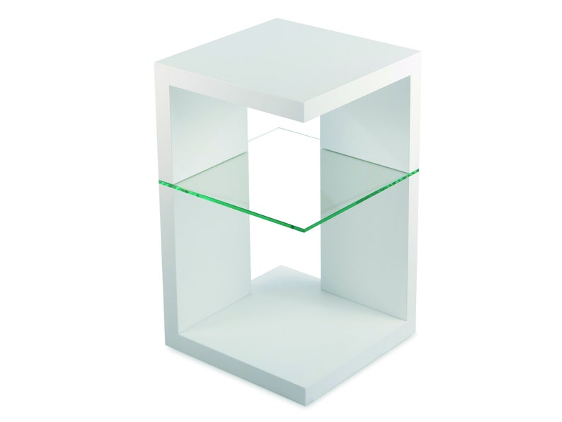 May include: White end table with a glass shelf. The table has a modern design with a square base and open sides.