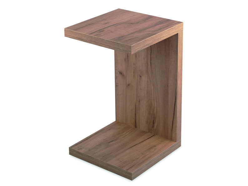 May include: A wooden C-shaped end table with a brown wood grain finish.