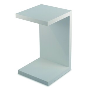 May include: A white, C-shaped, open-shelf end table with a smooth, flat surface. The table is made of a light-colored wood or plastic.