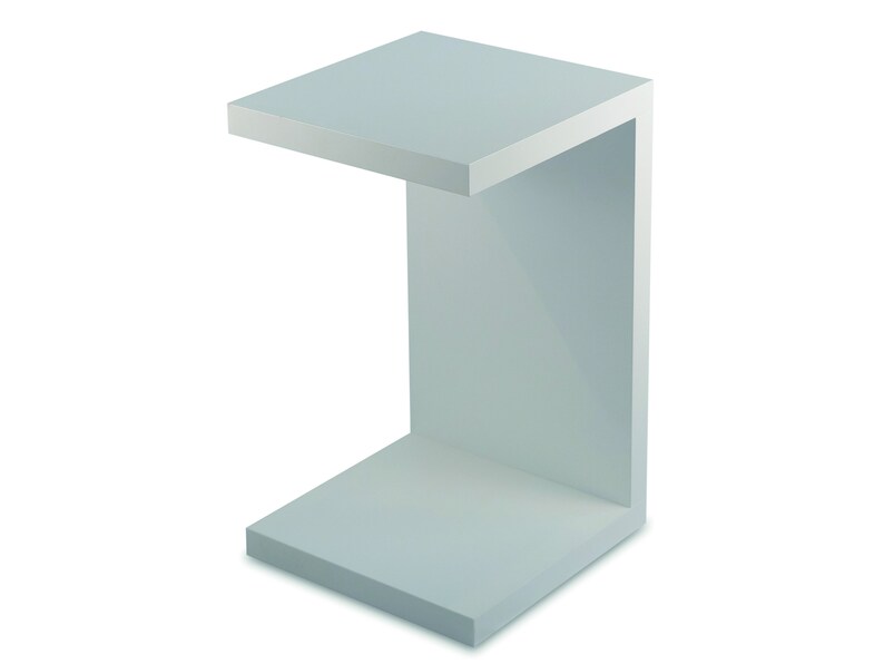 May include: A white, C-shaped, open-shelf end table with a smooth, flat surface. The table is made of a light-colored wood or plastic.
