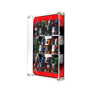May include: A clear acrylic display case showcasing a collection of toy race cars. The cars are in various colors, arranged against a backdrop of a red and checkered flag design. The case is rectangular and mounted on a white surface.