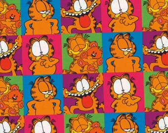 May include: A repeating pattern featuring the cartoon character Garfield in various poses. The orange cat is set against a backdrop of colorful squares in pink, green, blue, and orange.