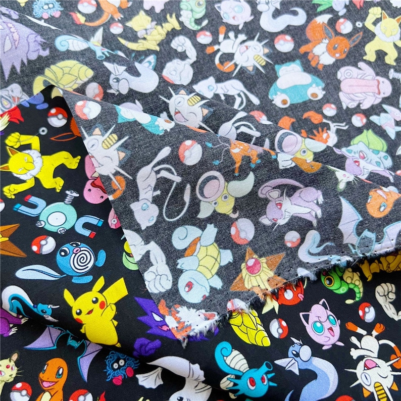May include: Black fabric with a repeating pattern of colorful cartoon Pokemon characters. The fabric features a variety of Pokemon, including Pikachu, Bulbasaur, Charmander, Squirtle, and many more.