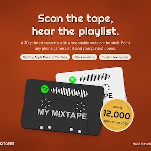 May include: A 3D-printed cassette tape featuring a scannable code on the shell. The text reads Scan the tape, hear the playlist, Spotify, Apple Music or YouTube, Black or white, Custom text option, MY MIXTAPE, and nearly 12,000 sales since 2022.