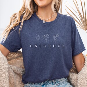 Unschool Homeschool Mom Shirt Raise Them Wild And Free Shirt Back to School Mama Wildflower Gift for Her Graphic Tee Mama Not All Classrooms Have Four Walls Outdoor Crunchy Homeschooling Present Her T-shirt Conspiracy Realist Theorist Theories Homeschooler Gifts Her Wife Mother Motherhood Free Thinker Truth Homemaker Stay At Home Mom Tin Foil Hat Humor Crunchy Conservative Libertarian Freedom Free Anti Government System For Friends Trendy Minimalist Aesthetic MAHA RFK Jr Agenda Co-op Unschooling