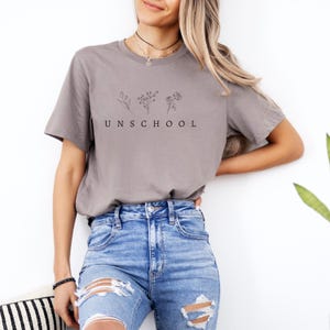 Unschool Homeschool Mom Shirt Raise Them Wild And Free Shirt Back to School Mama Wildflower Gift for Her Graphic Tee Mama Not All Classrooms Have Four Walls Outdoor Crunchy Homeschooling Present Her T-shirt Conspiracy Realist Theorist Theories Homeschooler Gifts Her Wife Mother Motherhood Free Thinker Truth Homemaker Stay At Home Mom Tin Foil Hat Humor Crunchy Conservative Libertarian Freedom Free Anti Government System For Friends Trendy Minimalist Aesthetic MAHA RFK Jr Agenda Co-op Unschooling