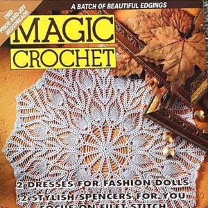 May include: A vintage "Magic Crochet" magazine cover featuring a large, white crocheted doily. The cover includes text about dresses, spencers, and small items with a dimensional effect. The background has autumn leaves and decorative elements.
