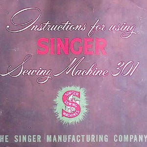 May include: A vintage instruction manual for the Singer Sewing Machine 301. The cover is a muted purple with white and pink text. The Singer logo is in a green and pink circle. The text reads "Instructions for using SINGER Sewing Machine 301".