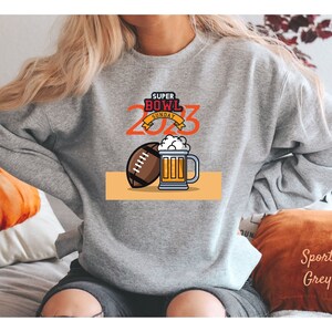Super Bowl Sunday 2023 Sweatshirt, Buffalo Bills, Kansas City Chiefs, Philadelphia Eagles Sweater - Unisex Heavy Blend Crewneck Sweatshirt.