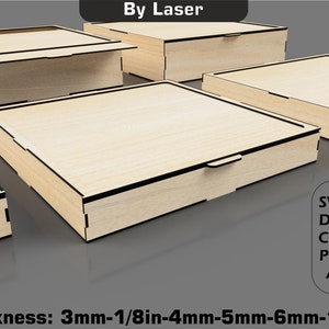 May include: Four wooden boxes with lids, designed for laser cutting. The boxes are made of light wood with a natural finish. The boxes are shown in different sizes and orientations. The text "By Laser" is at the top of the image. The text "Thickness: 3mm-1/8in-4mm-5mm-6mm-1/4in" is at the bottom of the image. The text "SVG DXF CDR PDF AI" is on the right side of the image.