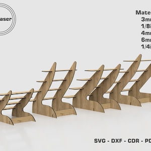 May include: Five wooden shelves in different sizes, each with a unique curved design. The shelves are made of plywood and are perfect for displaying small items. The shelves are labeled with the text "By Laser" and "Material 3mm, 1/8in, 4mm, 6mm, 1/4in".