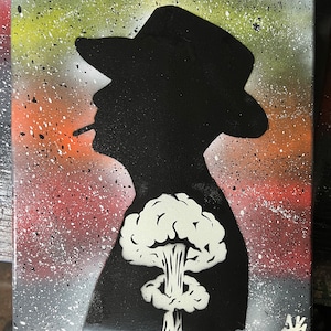 May include: A black silhouette of a person wearing a hat and smoking a cigarette. The person's chest is replaced with a white mushroom cloud. The background is a colorful spray paint pattern.
