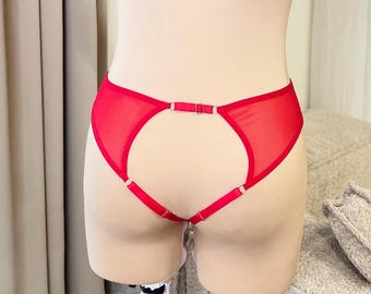 May include: Red mesh lingerie with a cut-out detail and adjustable straps.