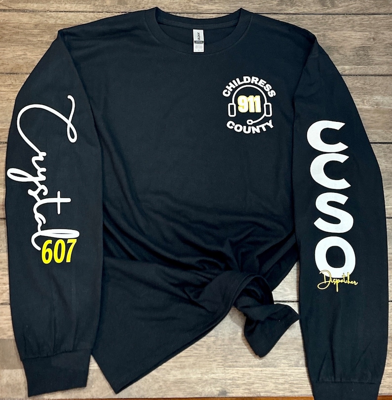911 dispatcher personalized long sleeve shirt
center name
center 
your name cursive
IAM911 and flag