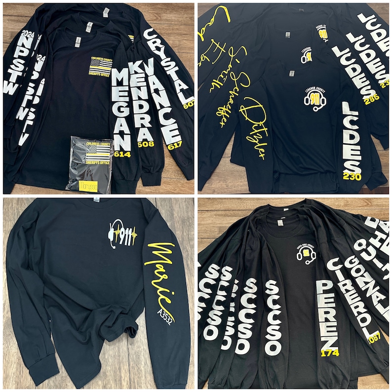 May include: Five black long-sleeve shirts with white text on the sleeves and back. The text on the sleeves includes names like "Crystal", "Kendr", "Vance", "Megan", and "Maric". The text on the back includes "Leonard County Sheriff's Office" and "911".