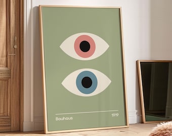 May include: A green poster with two stylized eyes, one with a pink iris and one with a blue iris. The poster has the text "Bauhaus" and "1919" at the bottom.
