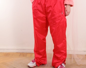 Pantalon coupe-vent rouge vintage des années 90 doublé zippé L